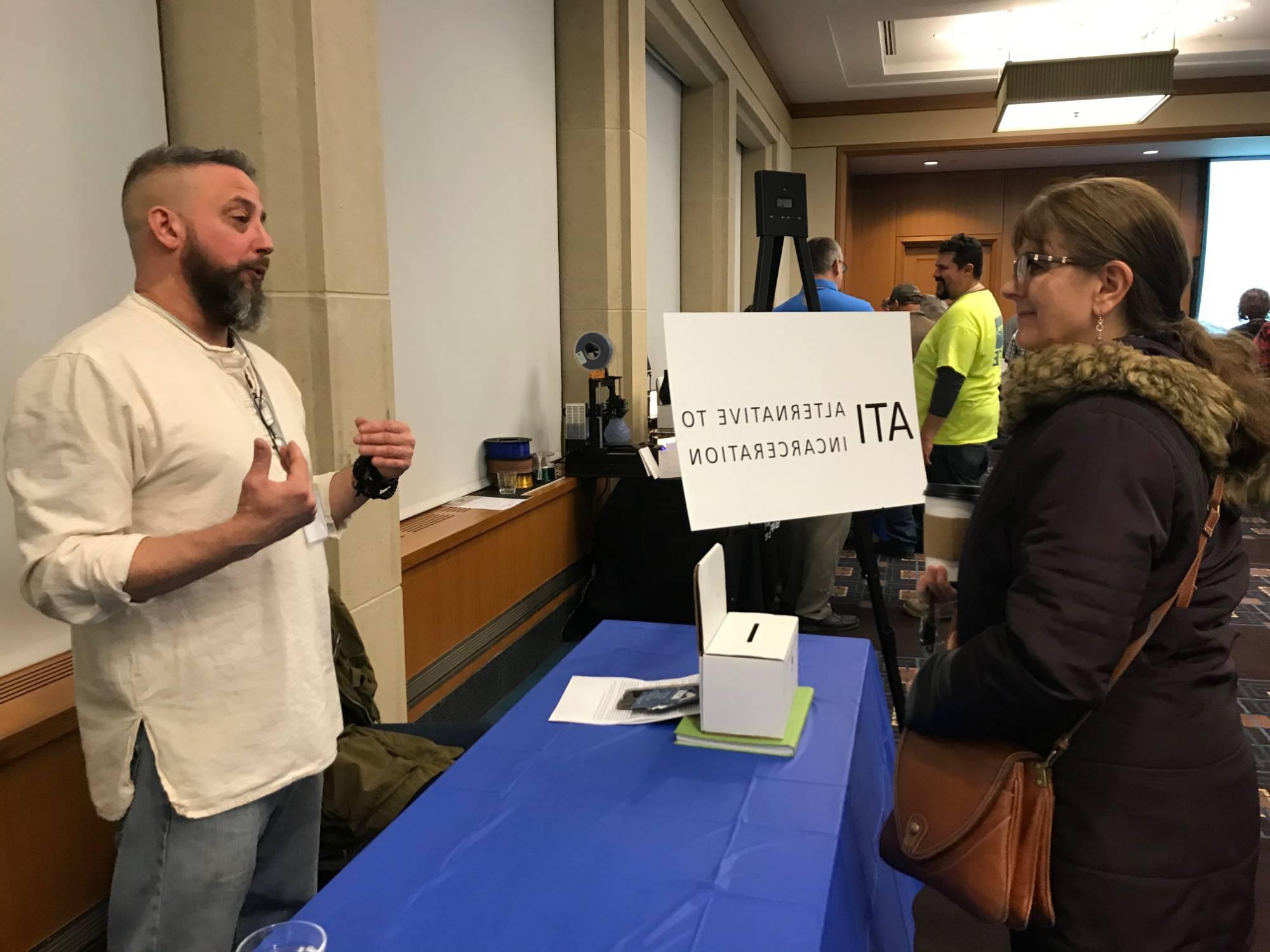 Veteran entrepreneur talking at showcase booth